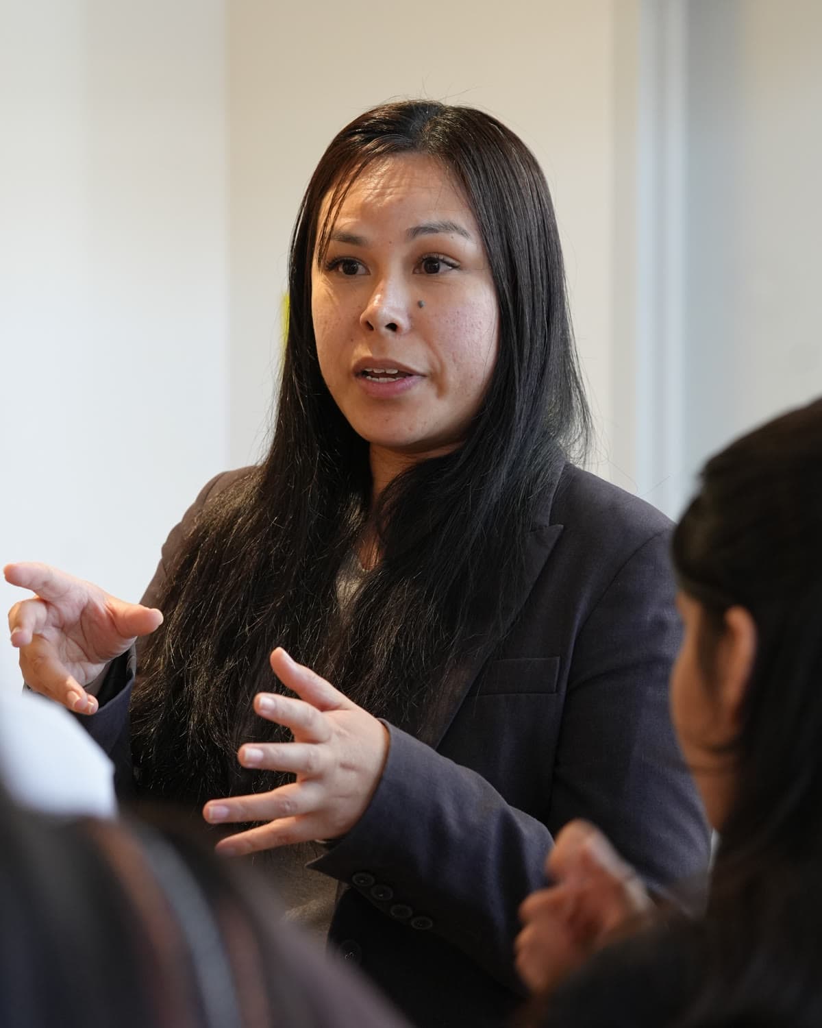 Gina Diana, who started LegaSeen, mid-sentence and talking with her hands